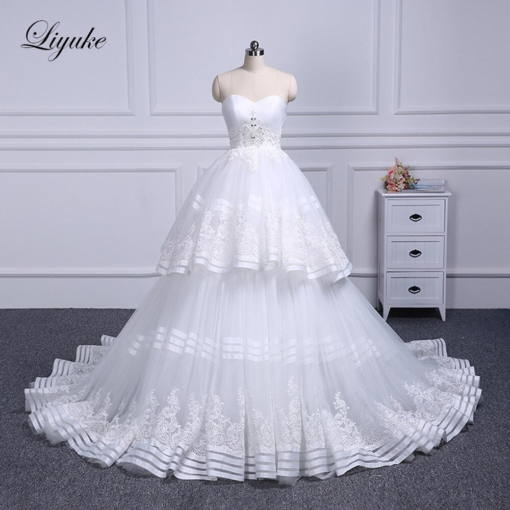 Liyuke Strapless Of  A-Line Wedding Dress With Tiered Skirt Of Court Train Wedding Gown