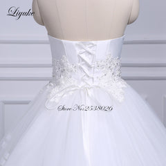 Liyuke Strapless Of  A-Line Wedding Dress With Tiered Skirt Of Court Train Wedding Gown