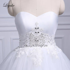 Liyuke Strapless Of  A-Line Wedding Dress With Tiered Skirt Of Court Train Wedding Gown