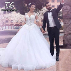 Scoop Ball Gown Wedding Dresses Illusion Back Long Sleeves Lace Appliques Floor Length Court Train Bridal Gown Dress 2019